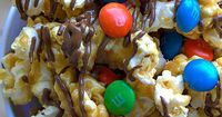 Homemade caramel corn is drizzled with chocolate and mixed with classic M&M's®, yum! #HeroesEatMMs #CollectiveBias #shop
