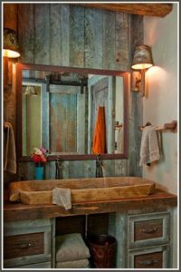 I don't know how practical a wooden sink would be but I love the sliding barn door for the shower (look in the mirror).